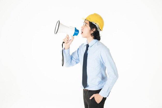 Young engineering man is announcing with megaphone 