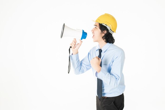 Young engineering man is announcing with megaphone 