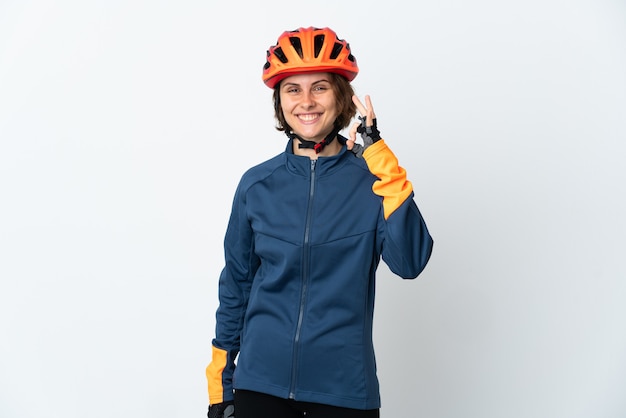 Young English cyclist woman isolated showing ok sign with fingers