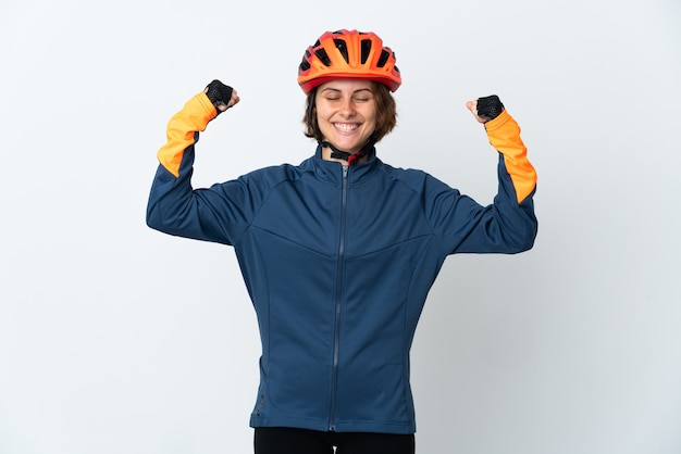 Young English cyclist woman isolated on white wall doing strong gesture