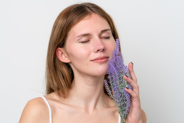 Young English woman holding a lavender plant Close up portrait