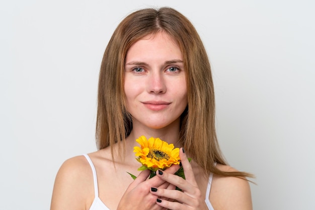 Young English woman holding a sunflower Close up portrait