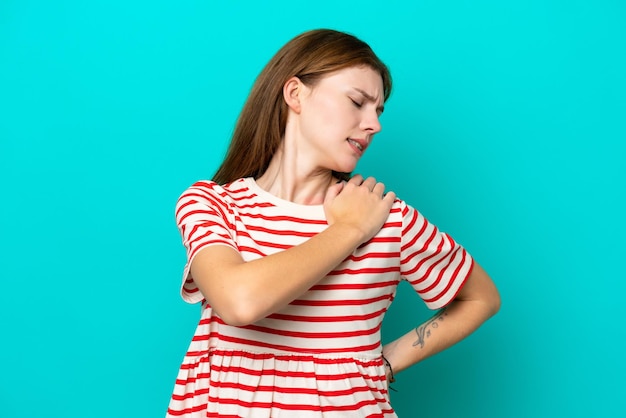 Young English woman isolated on blue background suffering from pain in shoulder for having made an effort