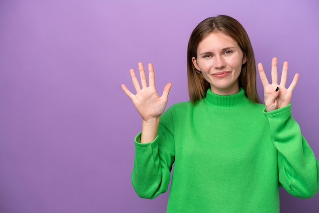 Young English woman isolated on purple background counting nine with fingers