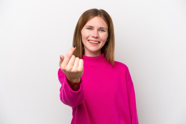 Young English woman isolated on white background doing coming gesture