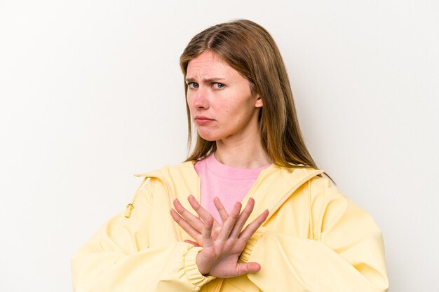 Young English woman isolated on white background doing a denial gesture