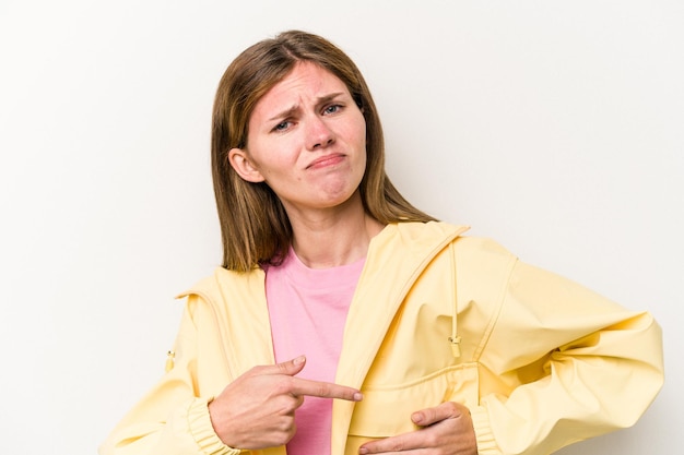 Young English woman isolated on white background having a liver pain stomach ache