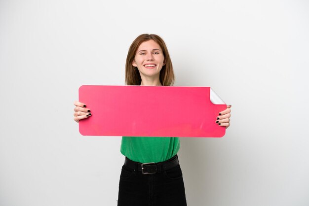 Photo young english woman isolated on white background holding an empty placard