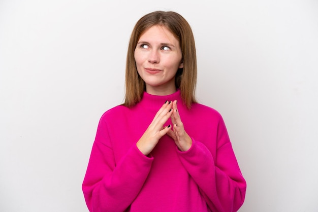 Young English woman isolated on white background scheming something