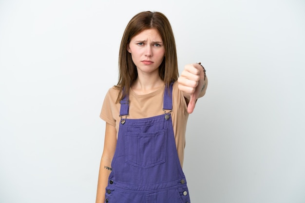 Young English woman isolated on white background showing thumb down with negative expression