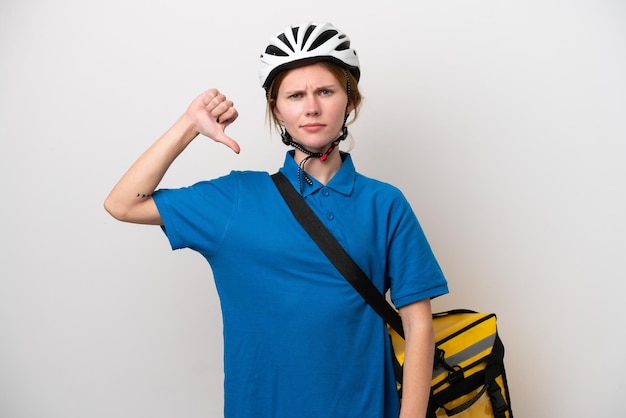 Young English woman with thermal backpack isolated on white background showing thumb down with negative expression