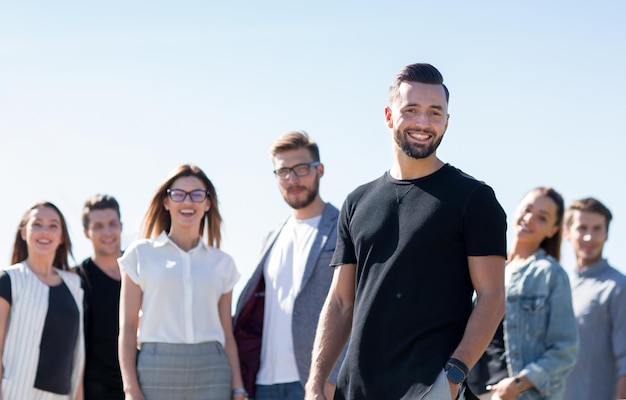 Young entrepreneur on the background of his business teamphoto with copy space