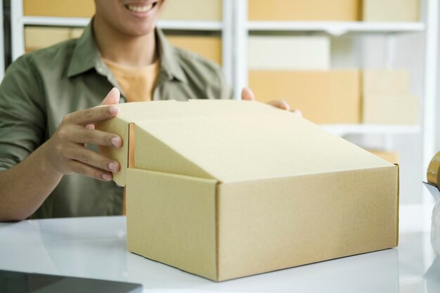 Young entrepreneur checking order preparing for delivery