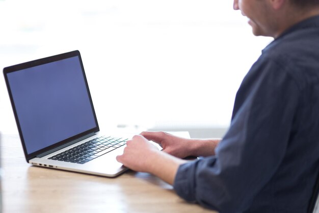 Young Entrepreneur Freelancer Working Using A Laptop In Coworking space