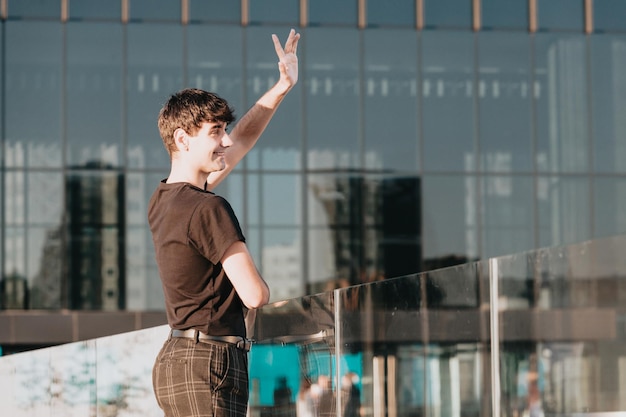 Young entrepreneur investor greeting someone in the financial
district during the sunset copy space, investing, crypto financial
freedom concept. happy about his new scholarship bur serious and
worry