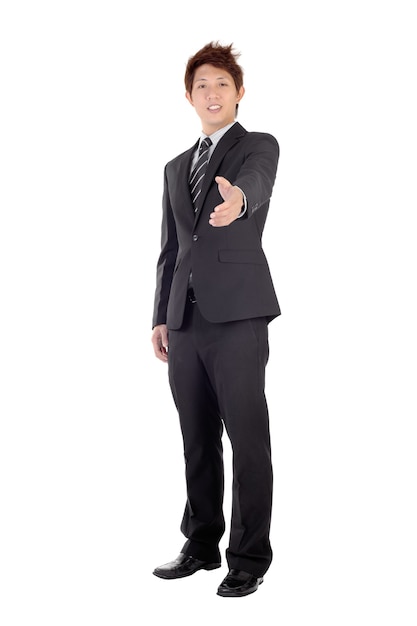 Young entrepreneur shake hand with you, full length portrait isolated on white.