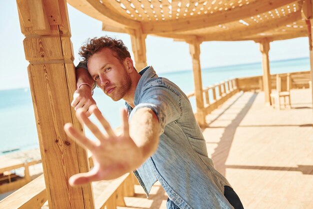 Young european man have vacation and enjoying free time on the beach of sea