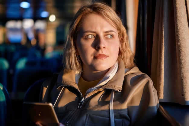 Young european woman in passenger cabin of ship