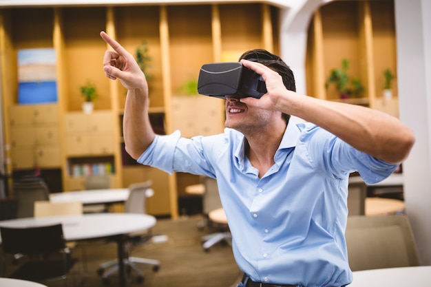 Young executive enjoying augmented reality headset at office