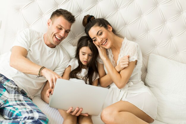 Young family in bed