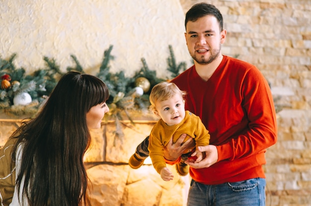 Young family in Christmas interior