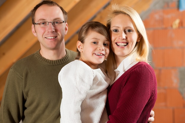 Young family on a construction site