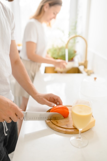 Young family cooks in a bright kitchen