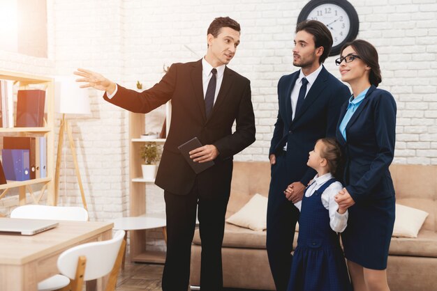 Young Family Discussing New Home with Realtor.