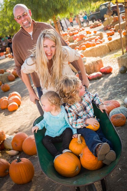 Young Family Enjoys a Day at the Pumpkin Patch