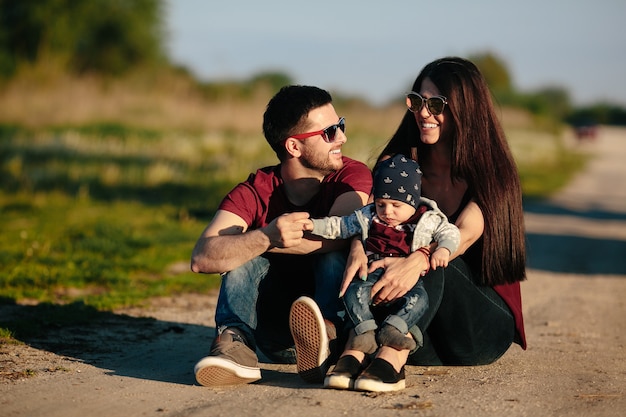 Young family have fun and relaxing outdoors in the countryside