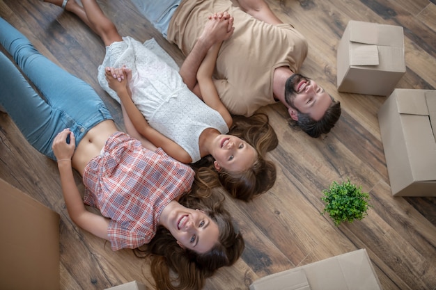 young family lying on the floor