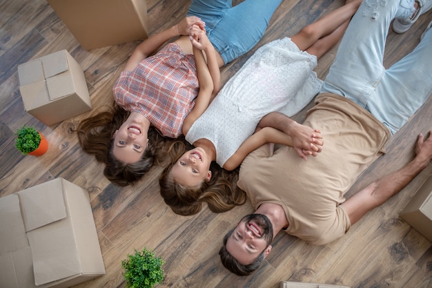 Young family lying on the floor