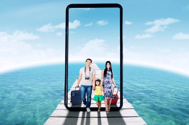 Young family taking a photo selfie on wooden jetty