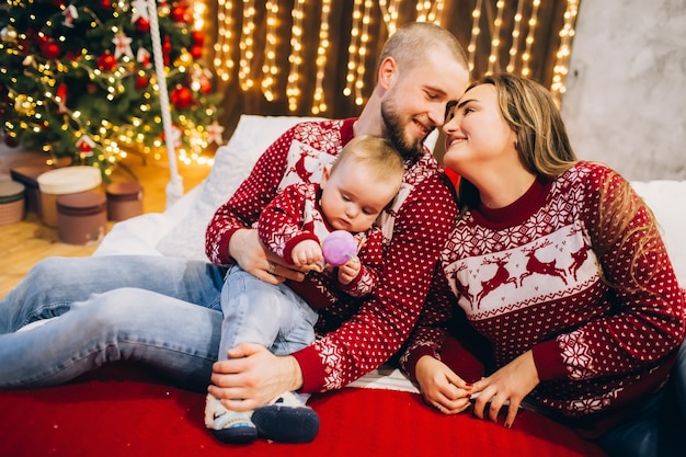 Young family with a child in the interior, Christmas atmosphere,