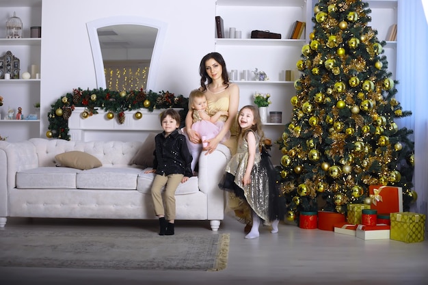 A young family with children decorates the house for the holiday. New Years Eve. Waiting for the new year.