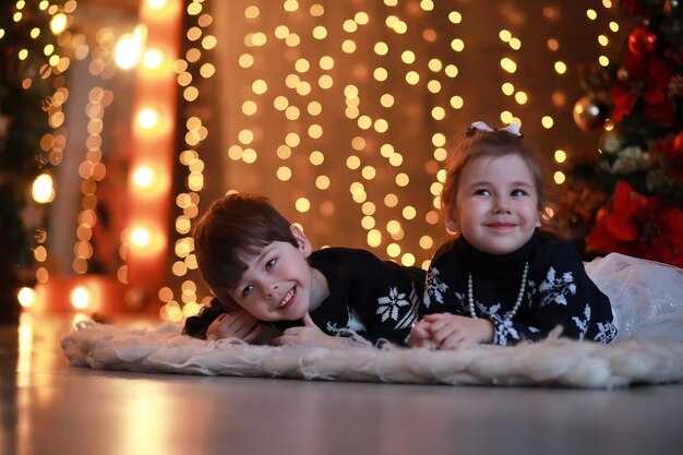 A young family with children decorates the house for the
holiday new years eve waiting for the new year