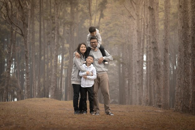 Young family with children having fun in nature