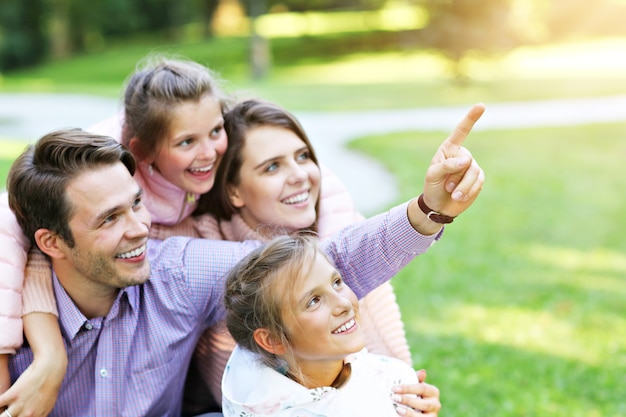 young family with children having fun in nature