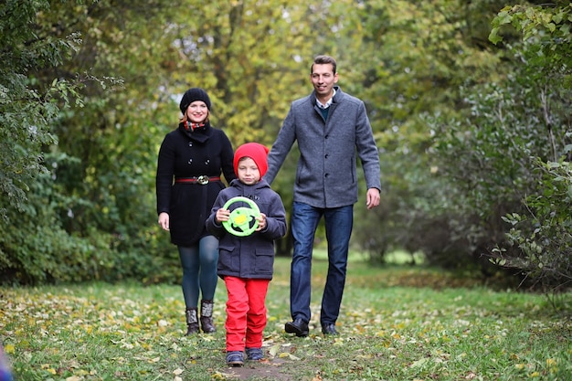 Young family with children on a walk in the park in spring