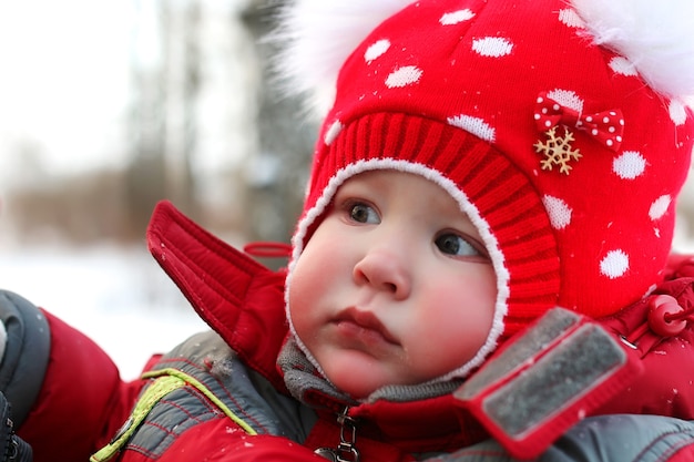 Young family with children on a walk in the park in winter