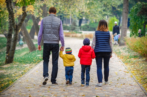 Young family with children walks in the park