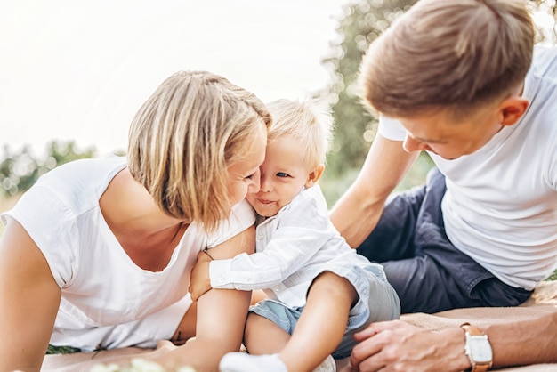 Young family with little son have fun outdoor