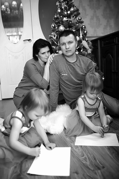 A young family with twins girls in the New Year's holiday