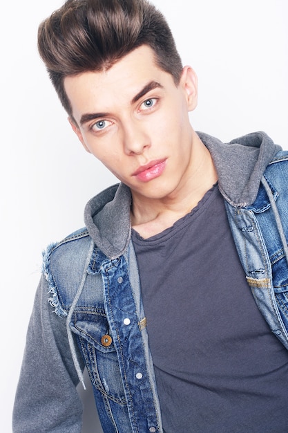 Young fashion male posing in studio