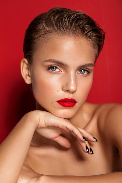 Young fashion model with red lips