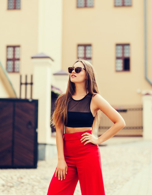 Young fashion woman in casual red pants