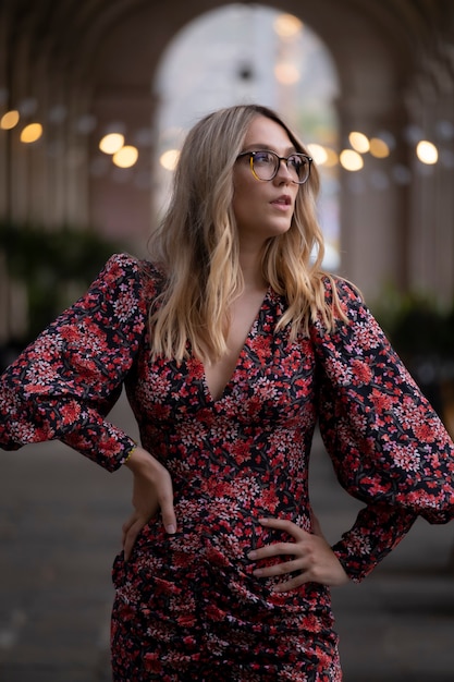 Young fashion woman looking while posing for the camera on a street in Barcelona