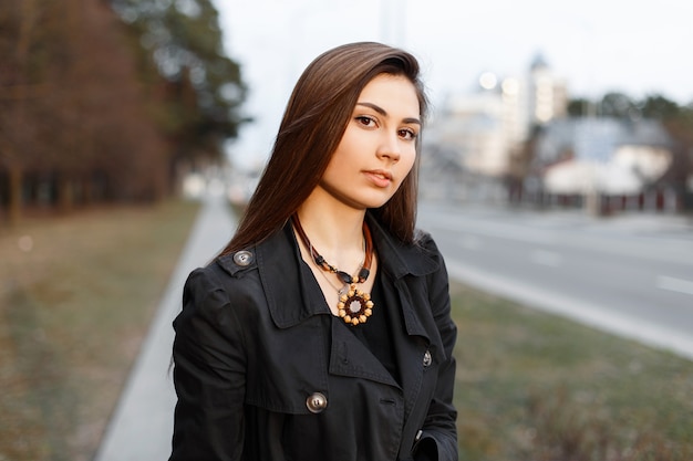 Young fashionable girl in spring black jacket