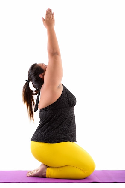  young fat Asian woman doing yoga poses