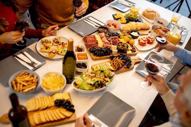 Young father having breakfast with his son and daughter at home, closeup on the food